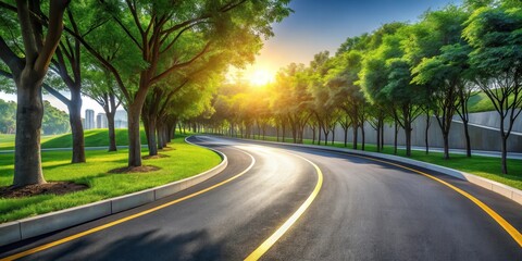 Fototapeta premium Asphalt Road Winding Through Lush Green Park at Sunset