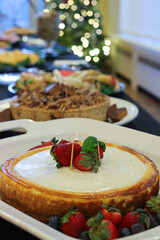 Strawberry Cheesecake with Festive Holiday Background