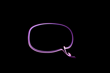 A long exposure photograph. Light painting photography, outline shape of a speech bubble in vibrant pink purple lights against a black background