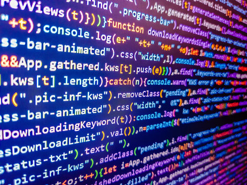 Computer code background. Virus in program code. White lines of code over purple background. Color coding on screen. Closeup of minified javascript file. Abstract screen of web developer.