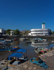 Grand Mosque in Moroni with boats in the foreground