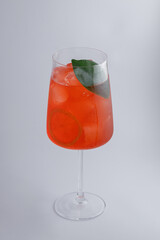 A Refreshing Red Cocktail Crafted with Fresh Herbs, Ice, and Perfect for Any Occasion