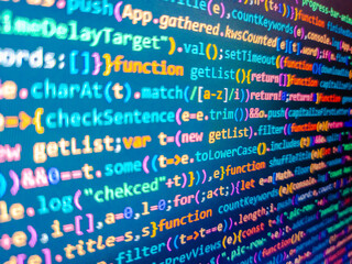 Big data and ai artificial intelligence cyber network. Code text written and created. Sequence of numbers with bright colors on a black background. Javascript code. Blue unique background.