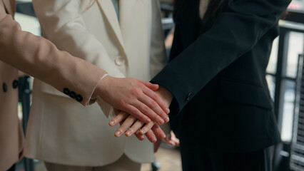 Fototapeta premium Business team success colleagues multiracial multiethnic women diversity Caucasian Asian Korean businesswomen girls female in office together stack hands teamwork cooperation union applause smiling