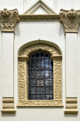 Arched patterned glass window of church. Copy space. Close-up. Selective focus.