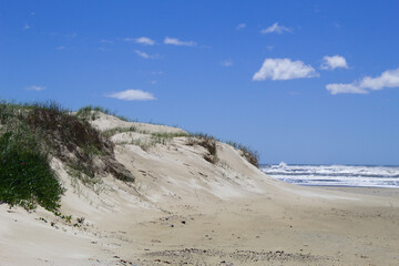 Sand dunes on Capao da Canoa beach in Brazil