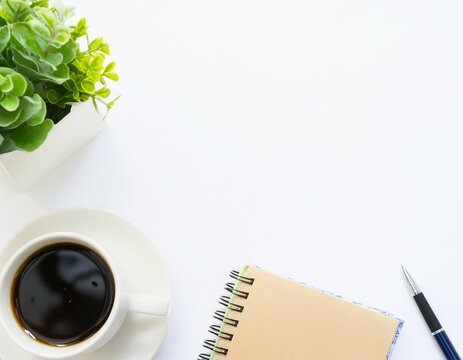 Office desk table with paper work, notebook and coffee cup; top view on white background 