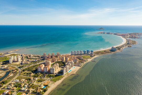 Aerial view of The Sandbar of the Minor Sea, is a seaside spit of Mar Menor in the Region of Murcia, Spain. The strip is 21 km long separating the Mediterranean Sea from the Mar Menor lagoon. Travel