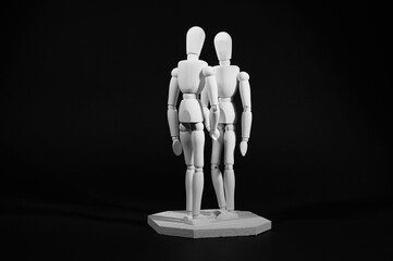 Gliederpuppen in wei&szlig; zeigen Begr&uuml;&szlig;ung 