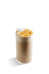 Closeup of a drink in a glass against a plain white background