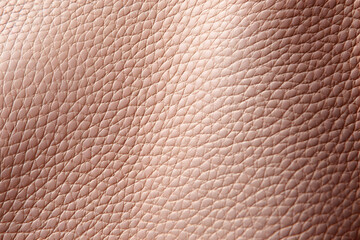 Close-up of textured blush pink leather, ideal for fashion, design, and textile backgrounds.  Shows detailed grain and subtle light reflection.