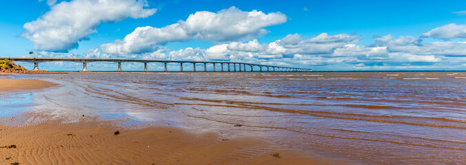 A panorama view from the waters edge at the southern end of the Confederation bridge, Prince Edward...