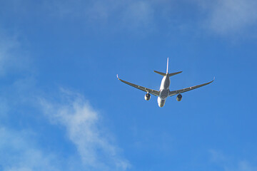 Plane in the sky in the clouds