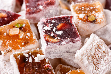 Sweet food Turkish delight, assorted rahat locum in form of cubes with nuts and powdered sugar, traditional food