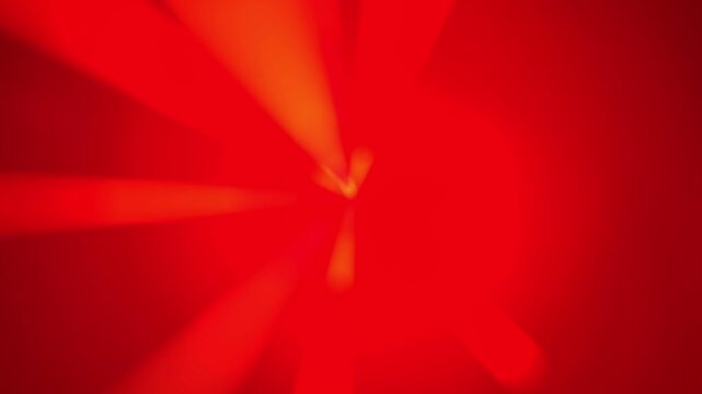 4k animation stock motion background showing abstract red rays moving on linear red background with speed effect.