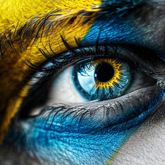 macro shot of eye in colors of Ukrainian flag