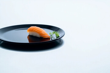 Minimalist Salmon Nigiri Sushi on a Black Plate with Fresh Garnish