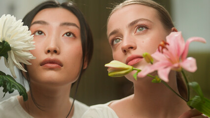 Portrait two pretty attractive young natural multiracial Japanese girls Asian Chinese Korean...