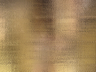 Close up of aluminium foil panel for heating insulation on the wall and roof. Metalic aluminium heating seal foil sheet with glossy and reflective pattern seamless background texture.