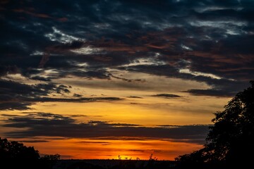 Dramatic sunrise with intense natural orange lights and idyllic dramatic scenery