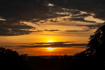 Dramatic sunrise with intense natural orange lights and idyllic dramatic scenery