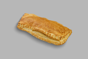This is a closeup image of a pastry placed on a gray background