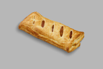 A delicious pastry that features holes in it on a gray background