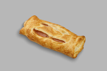 Closeup of a delicious pastry with a hole, on a gray background