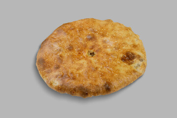 Here is a detailed closeup image of a cookie set against a gray background