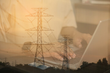 Energy innovation concept with power lines overlay and person typing on laptop, renewable technology theme