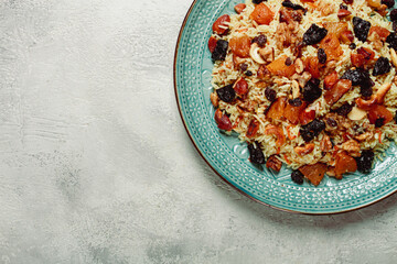 rice dish with dried fruits, nuts and spices of Middle Eastern cuisine, homemade, no people,