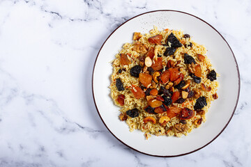 rice dish with dried fruits, nuts and spices of Middle Eastern cuisine, homemade, no people,