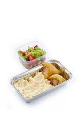white background disposable plastic and foil tableware airplane food snack mashed potatoes and stuffed peppers vegetable salad dietary program daily allowance one-time meals