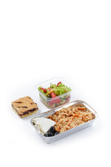 white background disposable plastic and foil tableware airplane food snack mashed potatoes and stuffed peppers vegetable salad dietary program daily allowance one-time meals