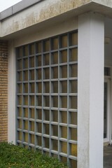 Glass block window illuminating building with geometric pattern