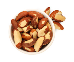 Tasty Brazil nuts in bowl isolated on white, top view