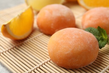 Tasty mochi on bamboo mat, closeup view