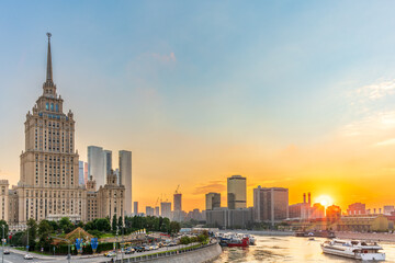 Obraz premium High-rise stalinist building near river at summer sunset in Moscow, Russia. Historic name is Hotel Ukraine.