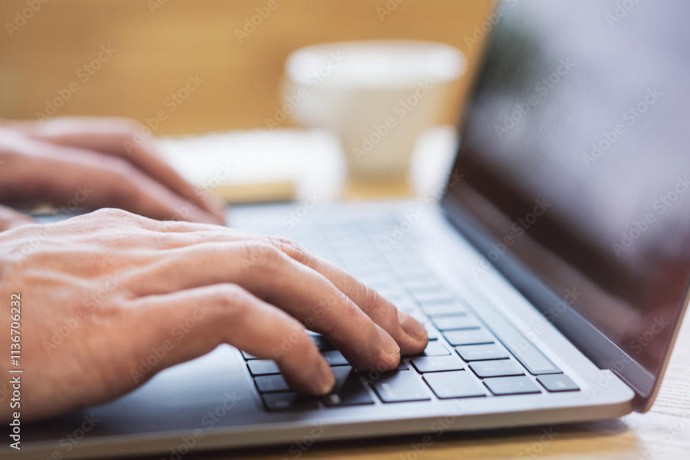 Poster with an office backdrop appearing blurry, a close-up presents a man's hands typing on a state-of-the