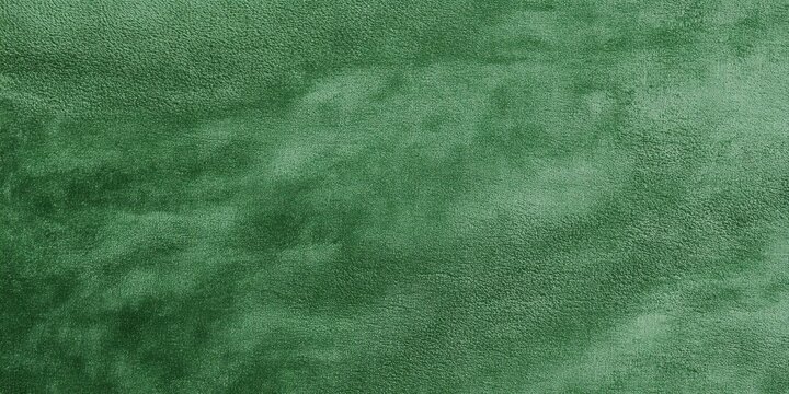 Soft green velour fabric texture showcasing rich color and plush surface ideal for upholstery and design projects