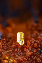 Mimetite with black goethite inclusion on red oxided quartz. Specimen from Mas Dieu, Laval-Pradel, France. Micro photography extreme close-up. microscope mineral crystal photography for Scientific use