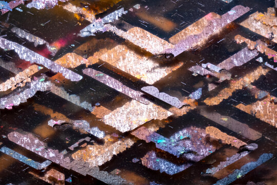 hematite inclusion in feldspar (commonly called sunstone). Specimen from China. Micro photography extreme close-up. microscope mineral crystal photography for Scientific use.
