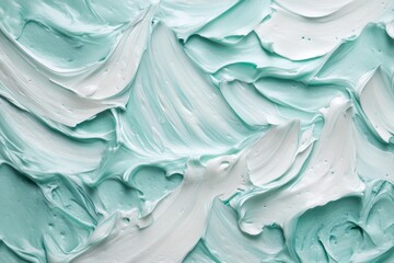 Textured surface of teal and white toothpaste swirls showcasing smooth application