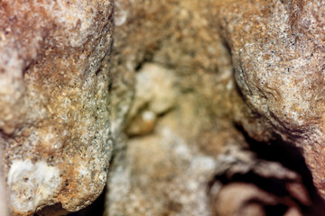 Creative abstract macrophotography of the stone texture with a shallow depth of field.