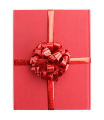 One book with red bow as gift isolated on white, top view