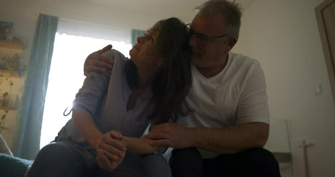 Husband embracing wife as she breaks down in tears, offering emotional support during a moment of despair, themes of love, empathy, mental health struggles, and connection
