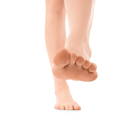 Young woman with flat feet isolated on white background, closeup