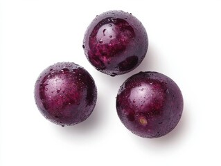 Three glistening purple plums adorned with droplets of water, emphasizing their freshness and natural allure on a white background.
