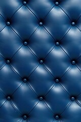 Fototapeta premium Close-up of a luxurious blue leather tufted upholstery with shiny buttons, exuding elegance and sophistication.