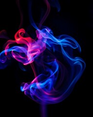 Fototapeta premium Vibrant Swirls of Colorful Smoke on Black Background